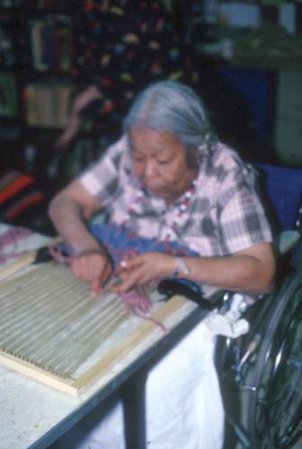 49 Woman Weaving